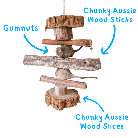 Wooden bird toy with labels "chunky aussie wood sticks" "Gumnuts" and "chunky Aussie Wood Slices" on a white background