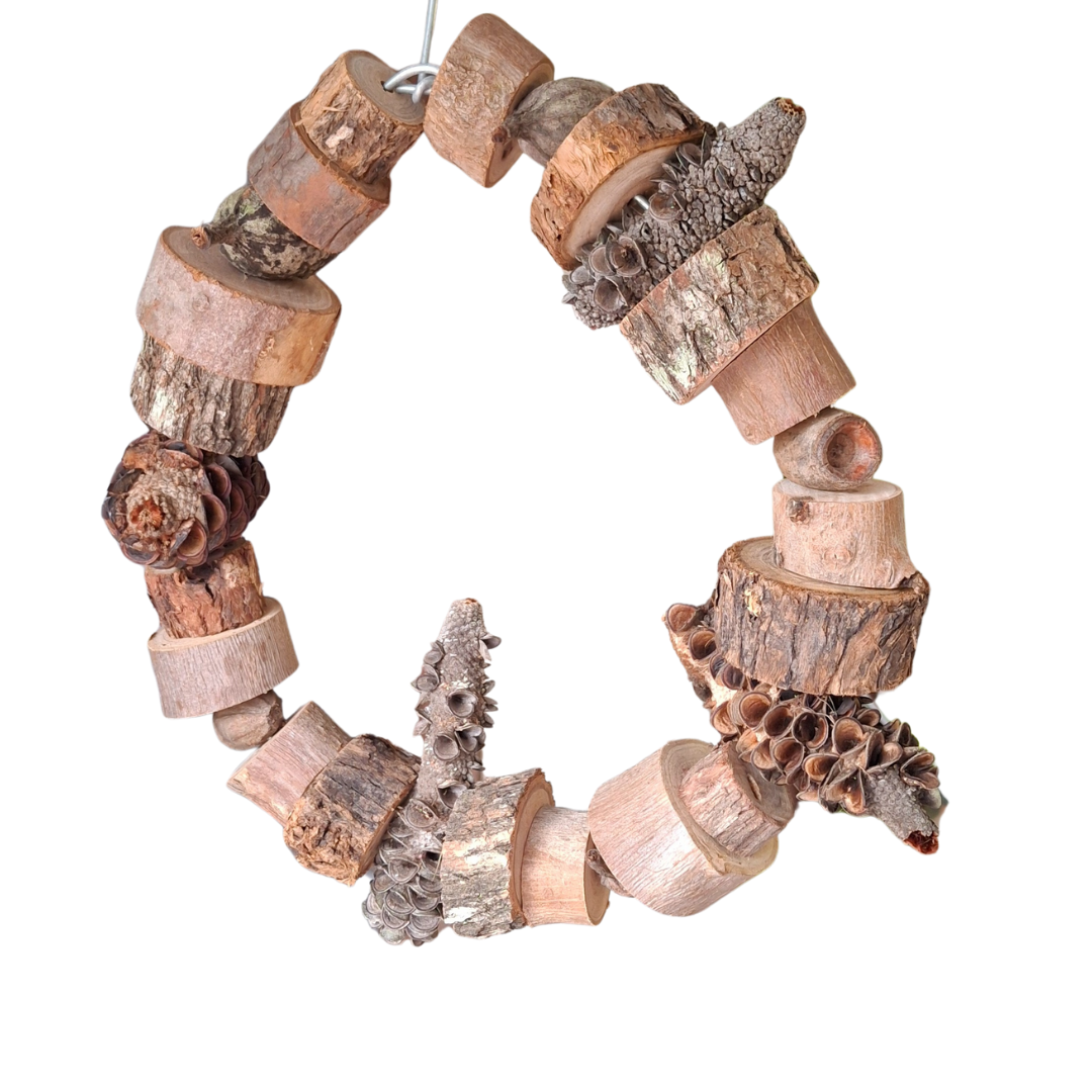 A round bird swing made from wood slices, banksia pods and gumnuts