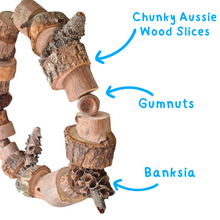 Natural circle bird swing with labels 'Chunky Aussie Wood Slices', 'Gumnuts', and 'Banksia' on a white background.