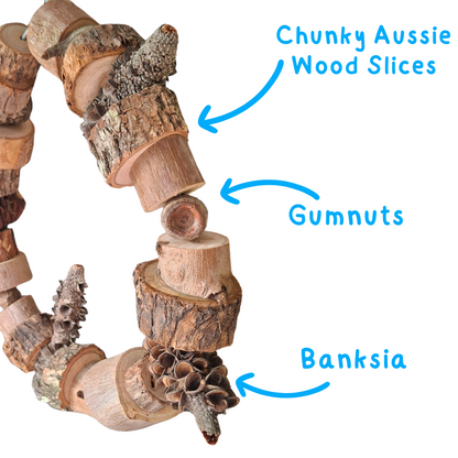 Natural circle bird swing with labels 'Chunky Aussie Wood Slices', 'Gumnuts', and 'Banksia' on a white background.